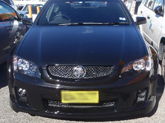 Front view of repaired black Holden after panel beating at Steve Koulis Smash Repairs