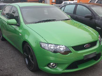 Repaired green Ford sedan after professional panel beating at Steve Koulis Smash Repairs