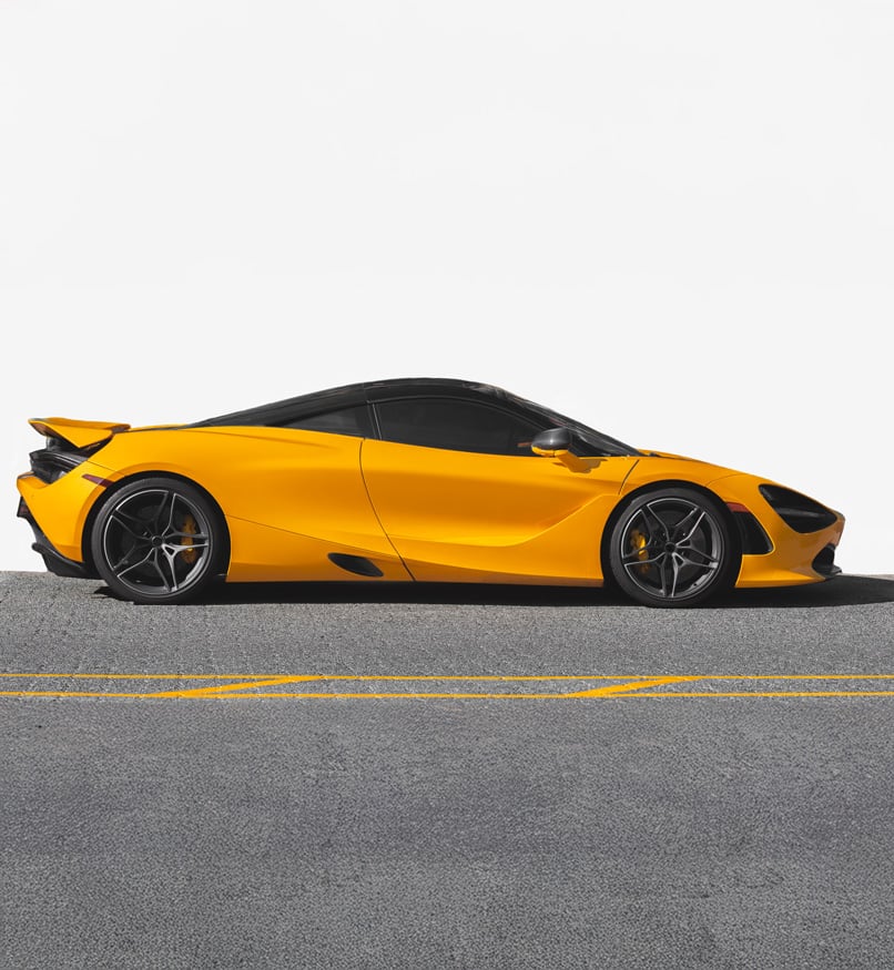 Yellow modern sports car parked on city street at Steve Koulis Smash Repairs